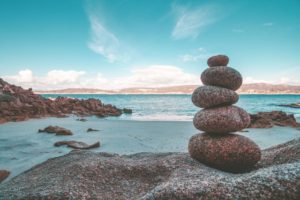 Small pebbles in a balanced tower on a beach